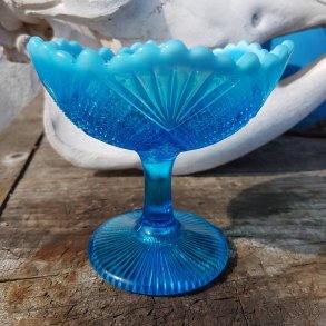 Opsats i turkis glas