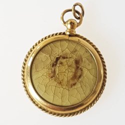 Antik medaljon med 2 billeder i forgyldt slv/metal