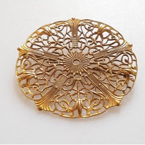 Sknvirke broche i forgyldt bronze