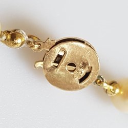 Herman Siersbl perlekde prydet med ls af 14 karat guld