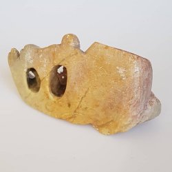 Gammel figur udskret i fedtsten