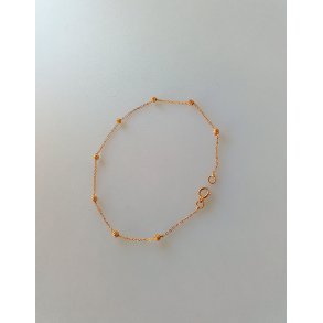 Feminin guld armbnd 